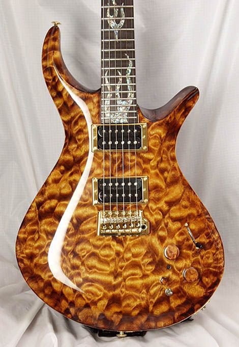 Driskill Diablo with two tigers inlaid into the fretboard